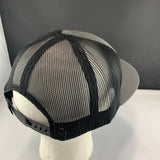 Black mesh cap on a mannequin head with a gray background