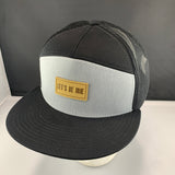 Black and gray cap with a 'Let's Be Irie' patch on a black background
