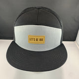 Black and gray cap with a 'Let's Be Irie' patch on a black background