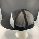 Black and gray mesh cap on a mannequin head with a gray background