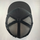 Black baseball cap with mesh back on a light gray background