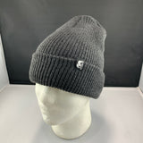 Gray beanie with a logo on a mannequin head against a black background