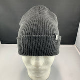 Gray knit beanie on a mannequin head with a dark gray background