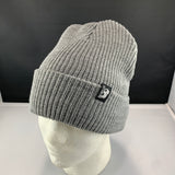 Gray knit beanie with a Let's Be Irie logo on a black background
