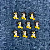 9 Embroidered penguin patches on a denim background