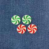 Four round peppermint candy patches on a denim background