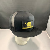 Black cap with California Republic patch on a mannequin head against a gray background