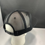 Black mesh cap on a mannequin head with a plain background