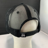 Black mesh cap on a mannequin head with a visible brand logo against a neutral background
