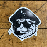 A vinyl decal of a cartoon cat wearing sunglasses and a black hat.
