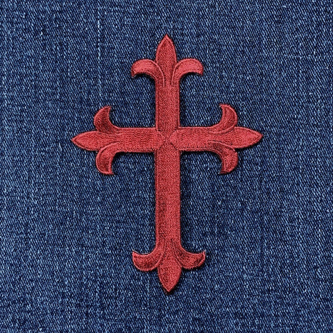 Large Burgundy Cross Applique Patch on a denim background