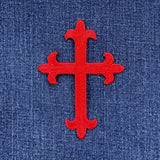 Red cross patch on blue denim fabric