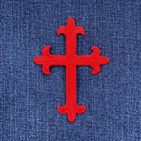Red cross patch on blue denim fabric