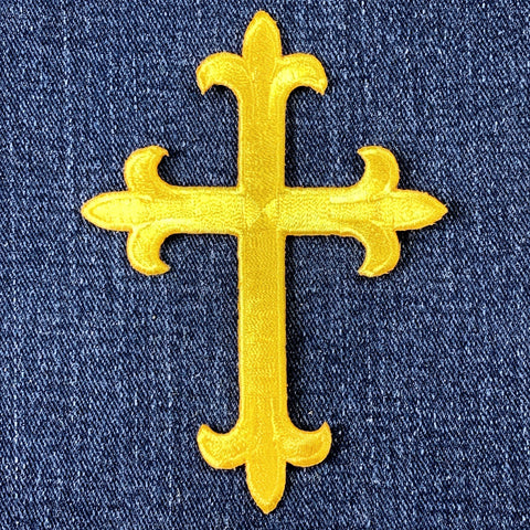 Yellow cross patch on denim fabric