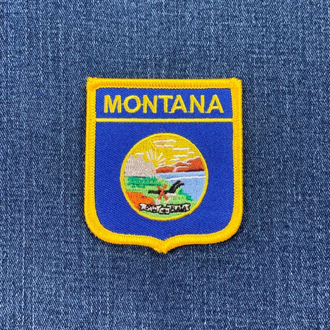 Montana state emblem patch on a blue denim background