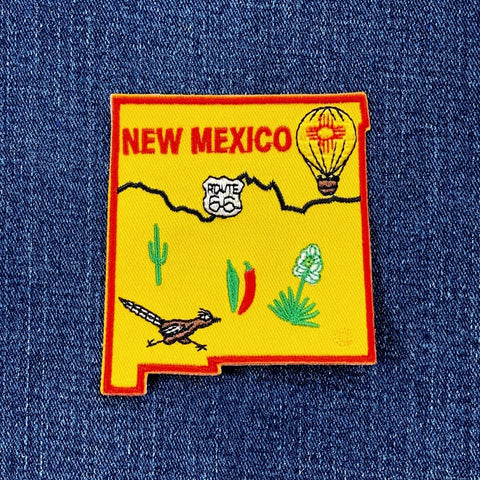 Embroidered patch of New Mexico on a blue denim background