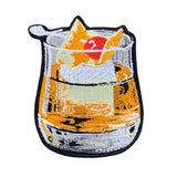 An embroidered patch of a whiskey old fashioned cocktail, on a white background.