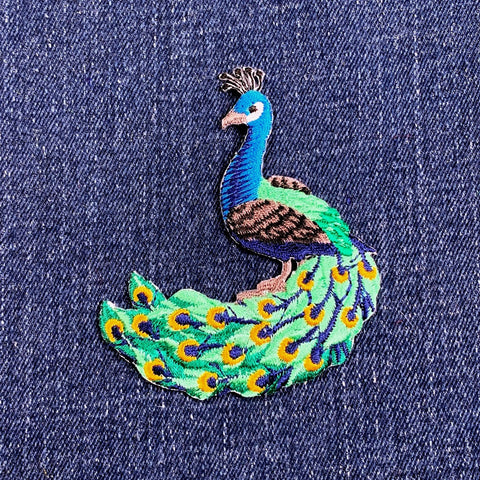 Peacock patch on denim fabric