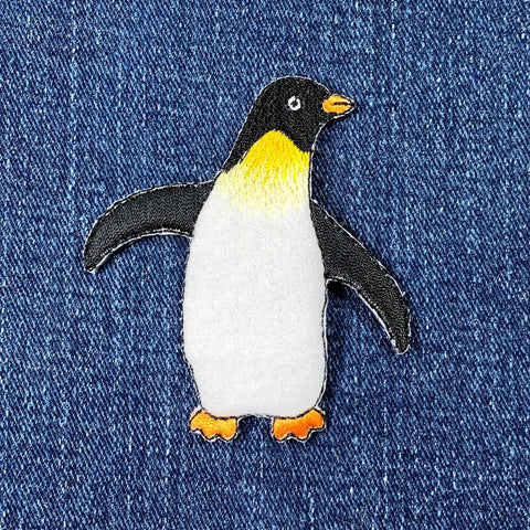 Penguin patch on denim fabric
