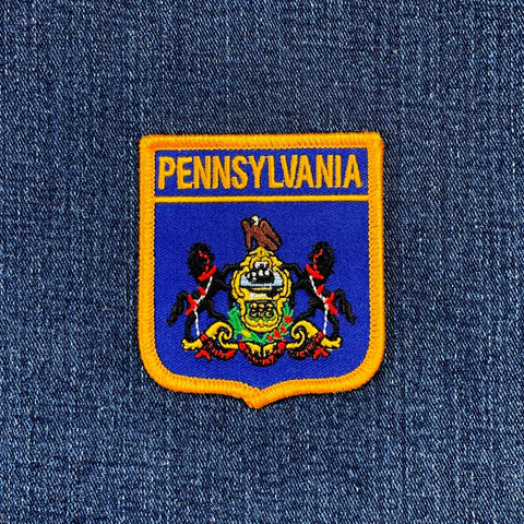 Pennsylvania state emblem patch on a denim background
