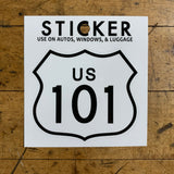 US 101 highway sign sticker displayed on a wood background