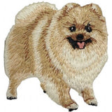 Embroidered patch of a Pomeranian dog standing on all fours with a happy expression.