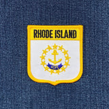 Embroidered patch of Rhode Island on a denim background