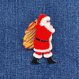Embroidered patch of Santa Claus on denim fabric
