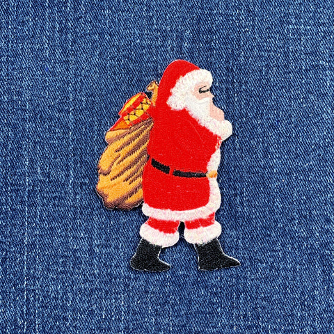 Embroidered patch of Santa Claus on denim fabric