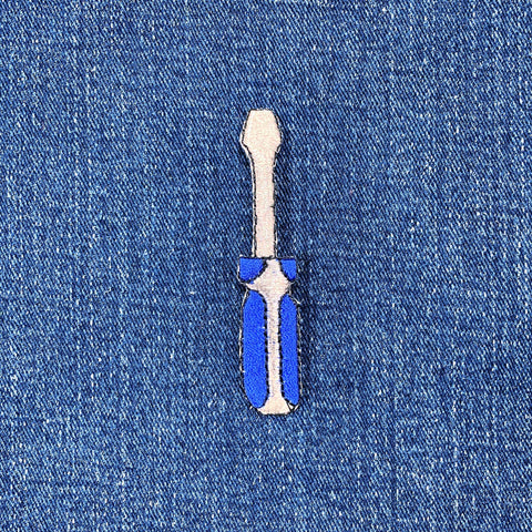 patch of a screwdriver on denim fabric