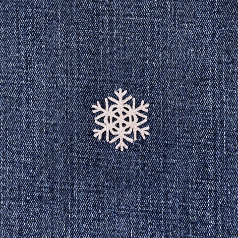Snowflake patch on denim fabric