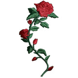 Embroidered red rose with green leaves on a white background