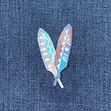 feather patch on denim fabric