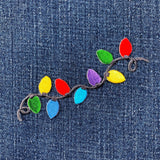 Colorful string lights patch on denim fabric