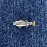 striped bass fish patch on a denim background
