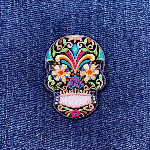 sugar skull patch on a denim background
