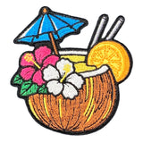 An embroidered patch of a tropical coconut cocktail with a blue umbrella, pink and white flowers, and an orange slice, shown on a white background.