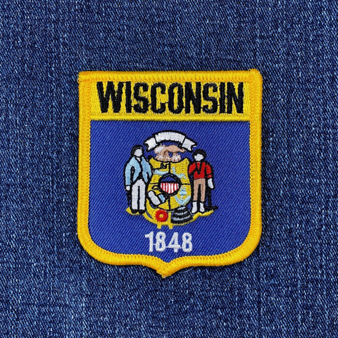 Wisconsin state patch with emblem and text on a denim background