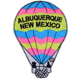 A colorful embroidered patch depicting a hot air balloon with 'ALBUQUERQUE NEW MEXICO' written on it.