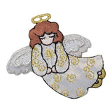 Decorative angel patch with gold and white details on a white background