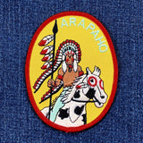 Patch with an Arapaho design featuring a Native American chief and horse on a blue background
