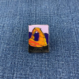 Pin with Arches National Park design on a denim background