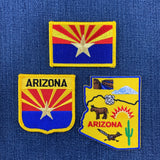 Three Arizona-themed patches on a blue fabric background