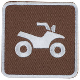 An embroidered square patch with rounded corners, featuring a white ATV symbol on a brown background with a white border.