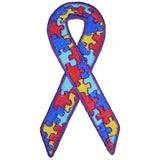 A ribbon-shaped patch with a puzzle piece design, featuring colors red, blue,  and yellow, with a purple outline, representing autism awareness.