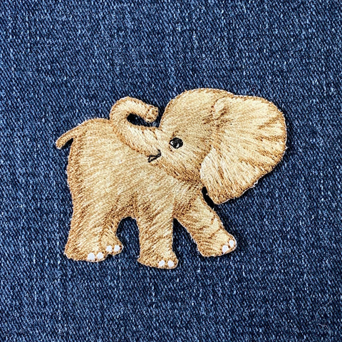 Embroidered elephant patch on denim fabric