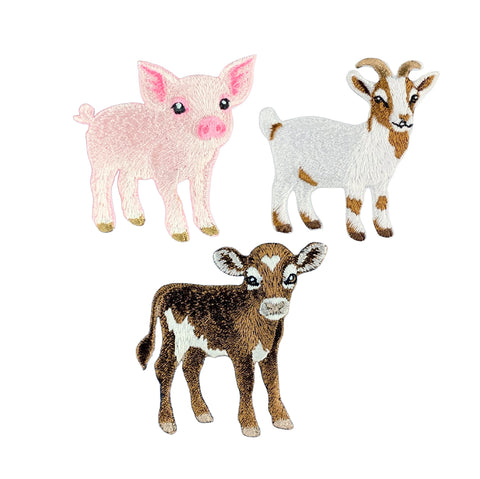 Three embroidered farm animal patches of a pink pig, a white goat with brown patches, and a brown and white calf, shown on a plain white background.