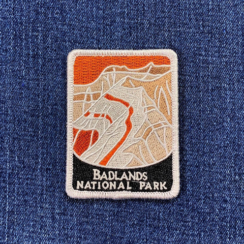 badlands patch on a denim background