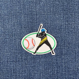 Embroidered patch of a baseball player on a denim background