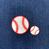 2 baseball patches, one small and one large, on a denim background